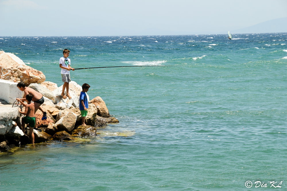 Kids fishing. Mati Nautical Sports Club marina. Nea Makri. Attica Greece.
