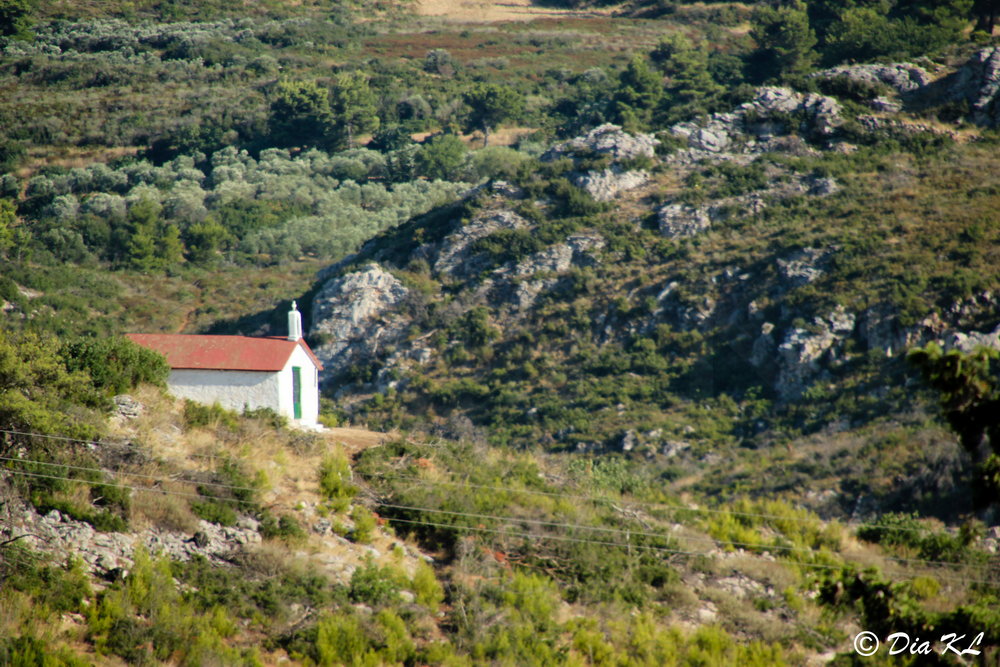 Church on the background, leaving Marathon dam. Attica Greece.