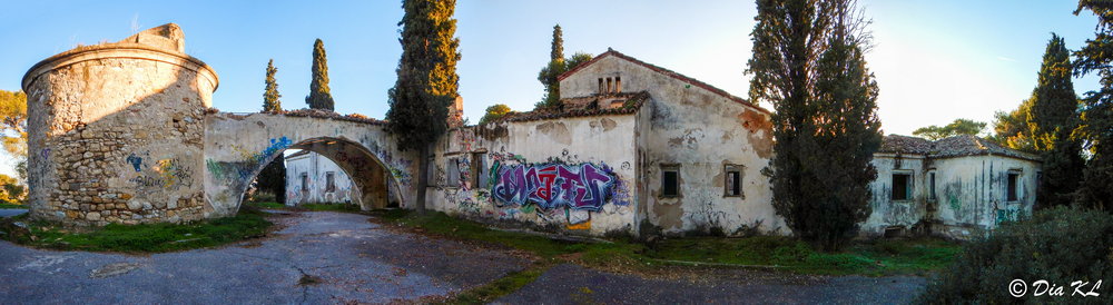 Entrance and circular tower of abandoned Villa Levidi urbex (urban exploration. Athens Greece.